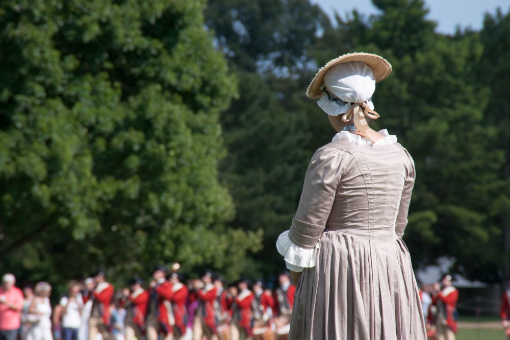 Re-enactor awaits the coming of the fife & drums corps in Williamsburg, VA
