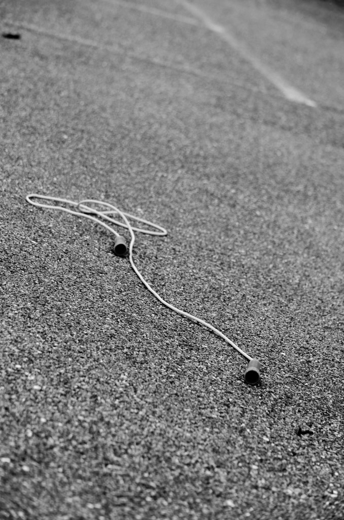 Jump rope on blacktop.