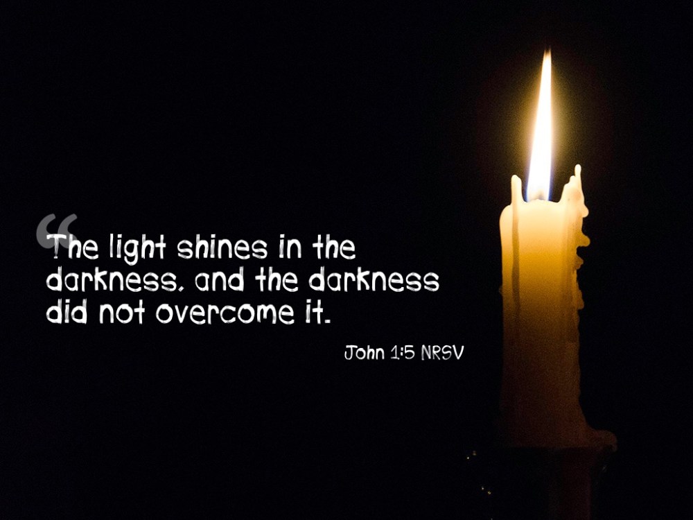 John 1:5, NRSV with single lit candle