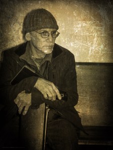 A musician leans forward