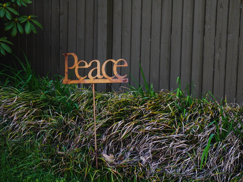 A lawn ornament which simply states, “Peace.”