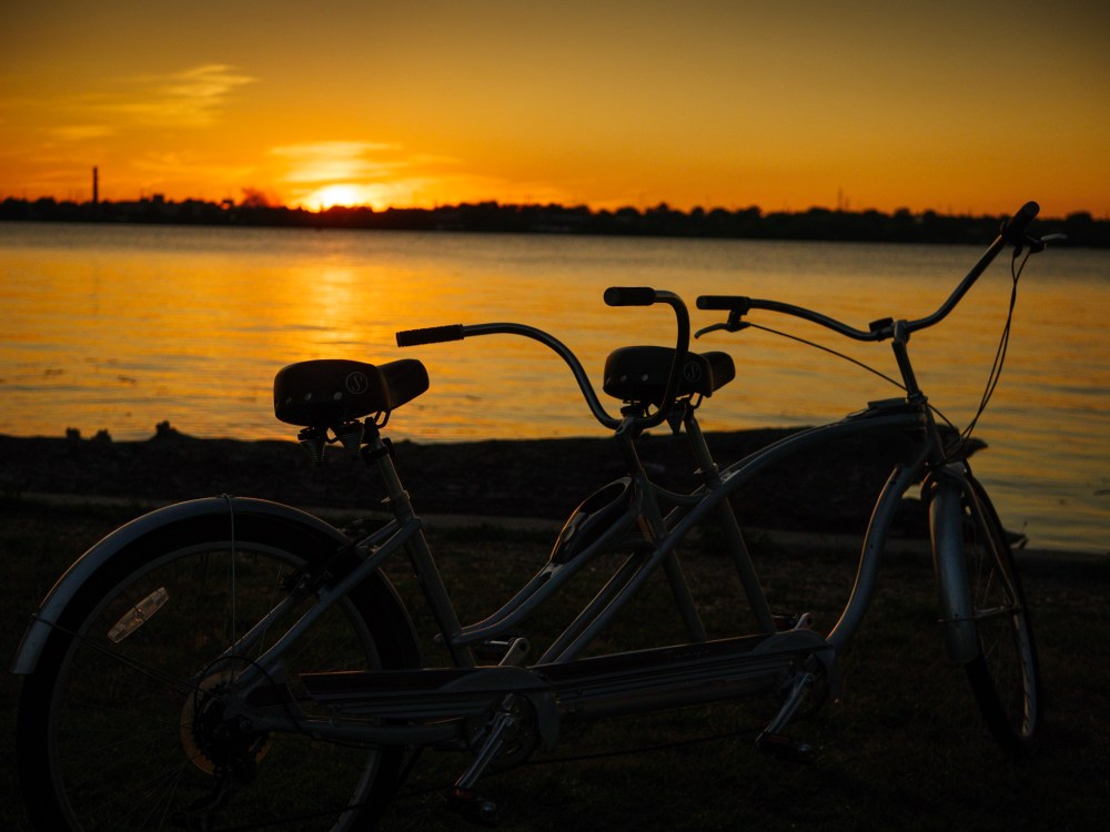 A tandem bike as the sun sets.