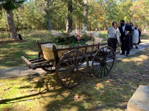 A woven bamboo casket, on a hand drawn cart